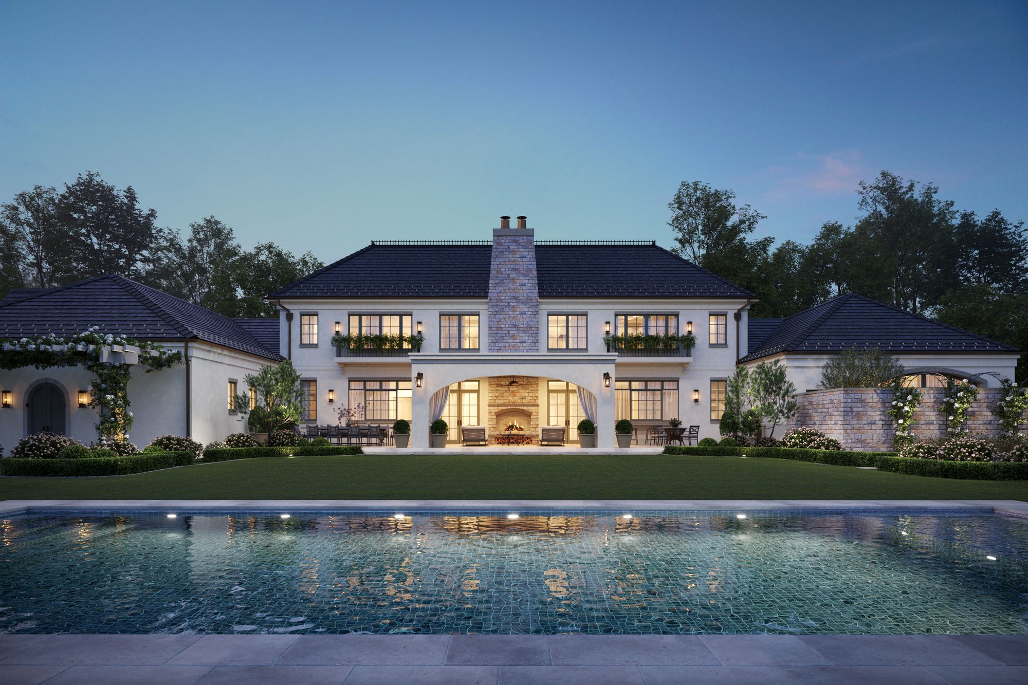 French country house and pool at dusk